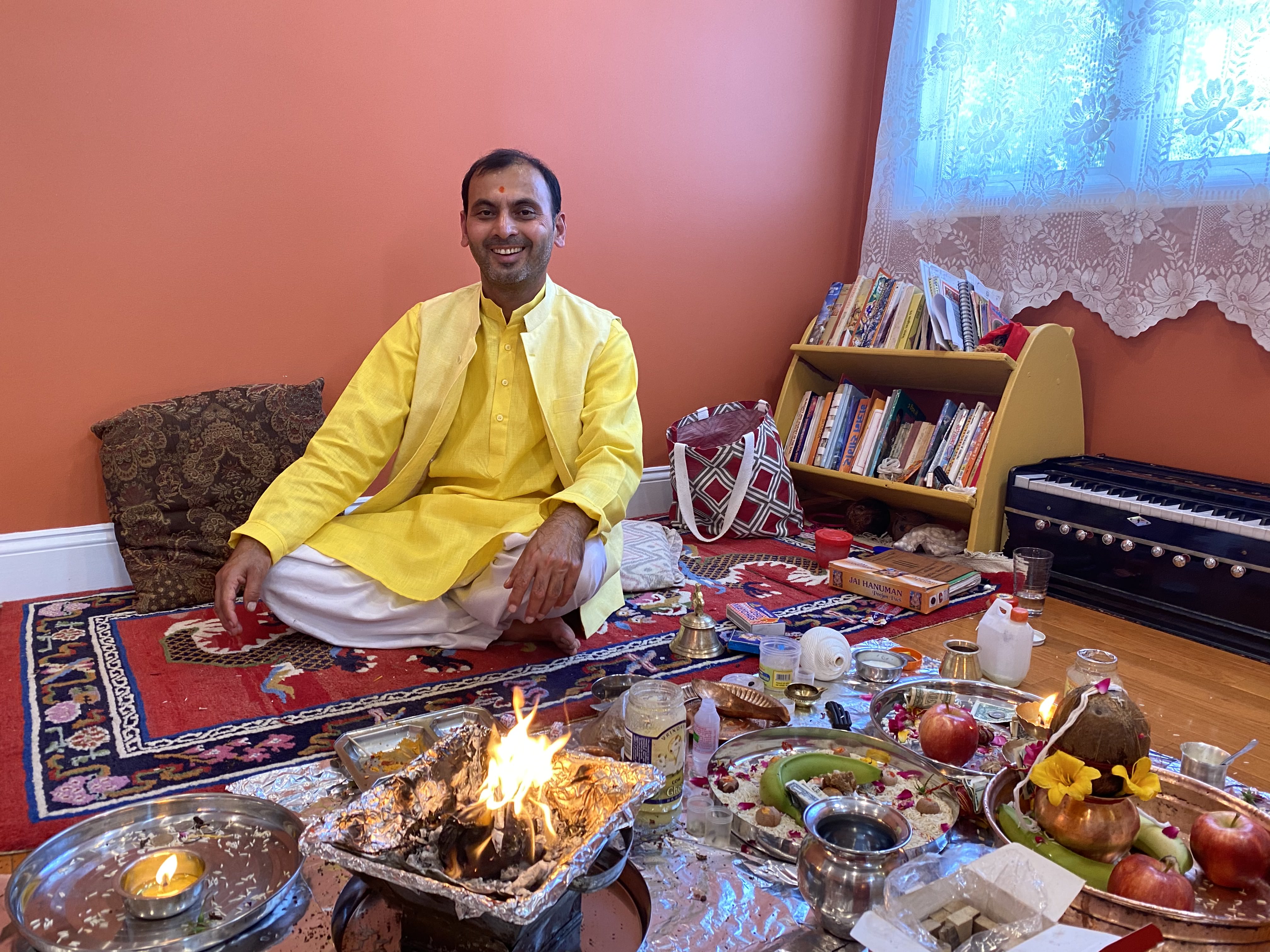 Pandit Harish Sharma at mandir with hindu deities