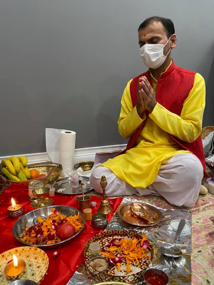 Pandit Harish Sharma at mandir with hindu deities